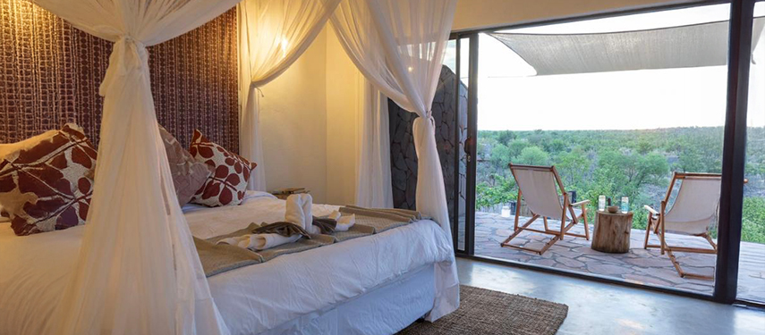 Double bedroom with a view at Nantwich Lodge, Hwange National Park