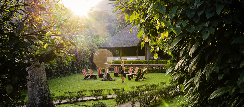 Gorilla Forest Lodge exterior with campfire in Bwindi Impenetrable Forest, Uganda
