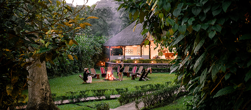 Gorilla Forest Lodge exterior with campfire in Bwindi Impenetrable Forest, Uganda