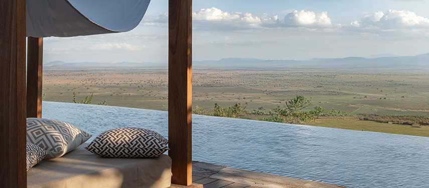 Inifinity pool at luxury safari lodge in Tanzania with views across the Serengeti