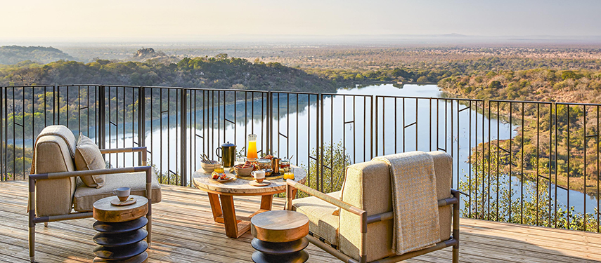 Afternoon tea served at Malilangwe House, with breathtaking views across Malilangwe Dam and the valley below.