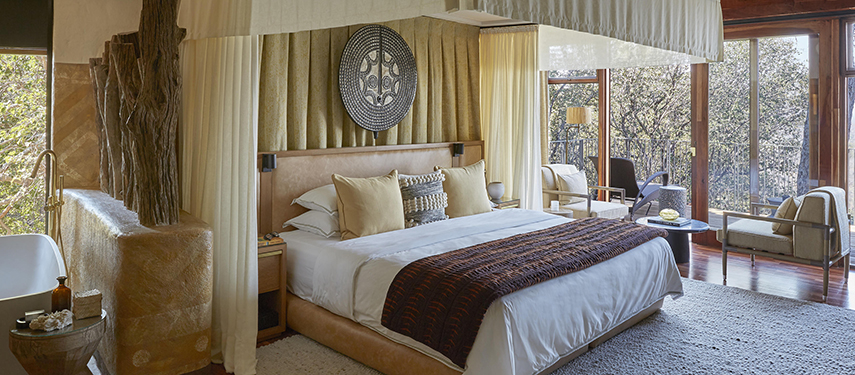 Opulent private bedroom suite at Singita Malilangwe House