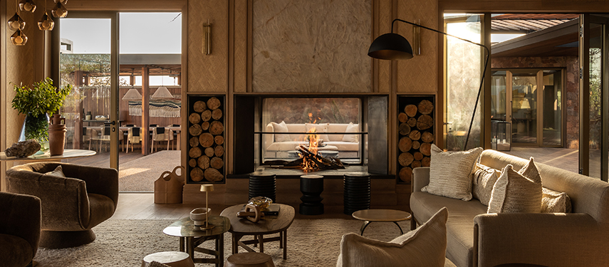 Main lounge and fireplace at Singita Milele luxury safari lodge