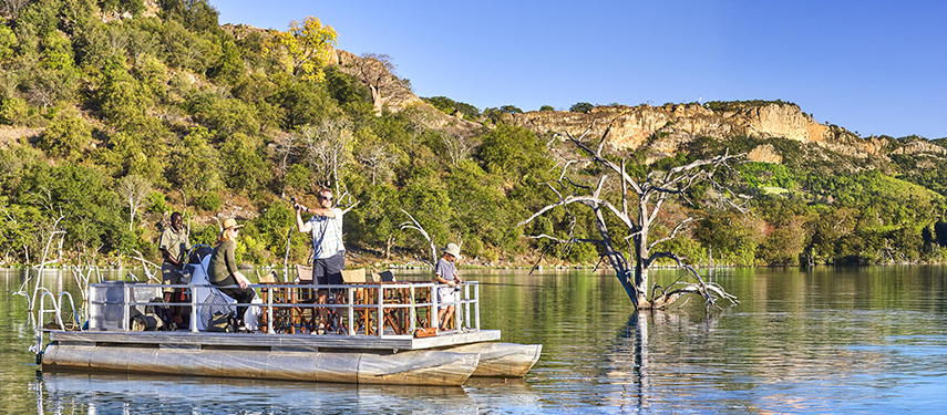 Tourists fishing on Malilangwe Dam, Zimbabwe