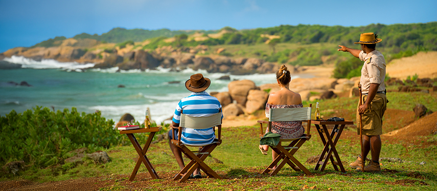 Tourist couple enjoy a coastal picnic in Sri Lanka