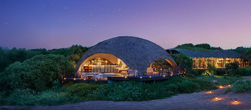 Lounge and bar area of Uga Chena Huts at sunset, Sri Lanka