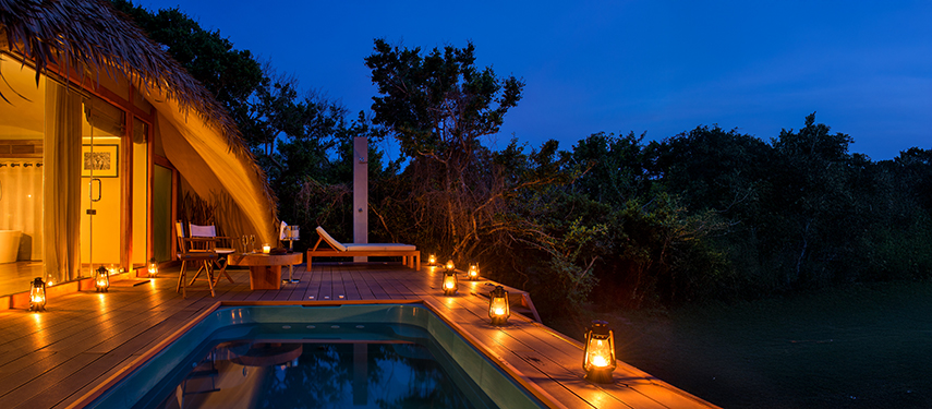 Romantic candle-lit suite with a private plunge pool at Uga Chena Huts, Sri Lanka