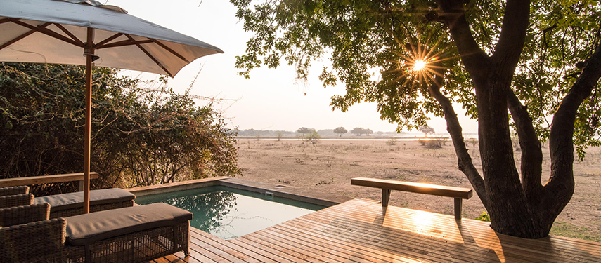 Chikwenya Camp swimming pool at sunset, Zimbabwe