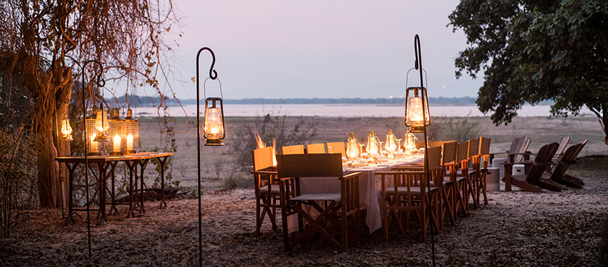 Dinner setting at dusk on safari in Mana Pools National Park, Zimbabwe