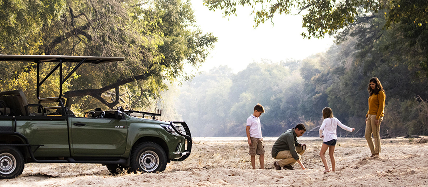 Young family on safari in Zimbabwe's Mana Pools National Park