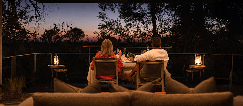 Enjoying drinks at sunset at Chitabe Camp, Okavango Delta
