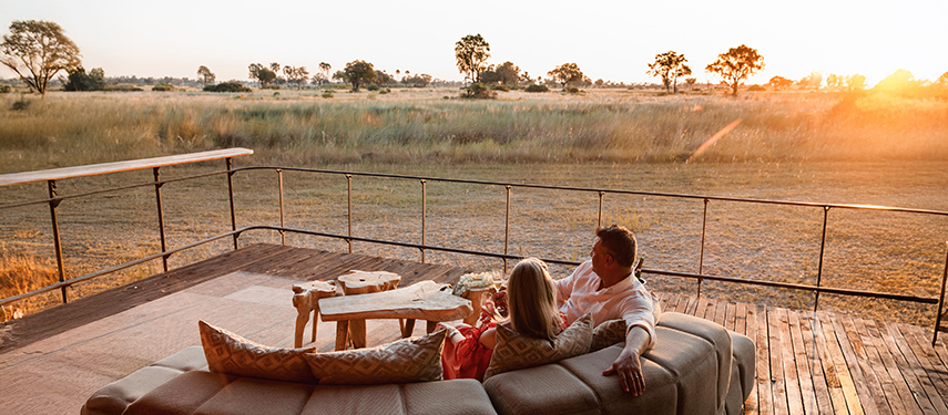 Enjoying drinks at sunset at Chitabe Camp, Okavango Delta