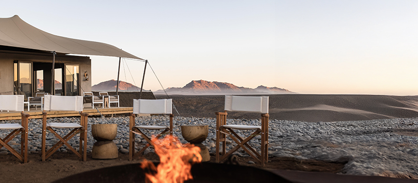 Kulala Desert Lodge Campfire at sunset in Sossusvlei, Namibia