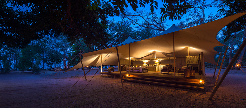 The exterior of a private safari suite at night Little Ruckomechi Camp, Zimbabwe