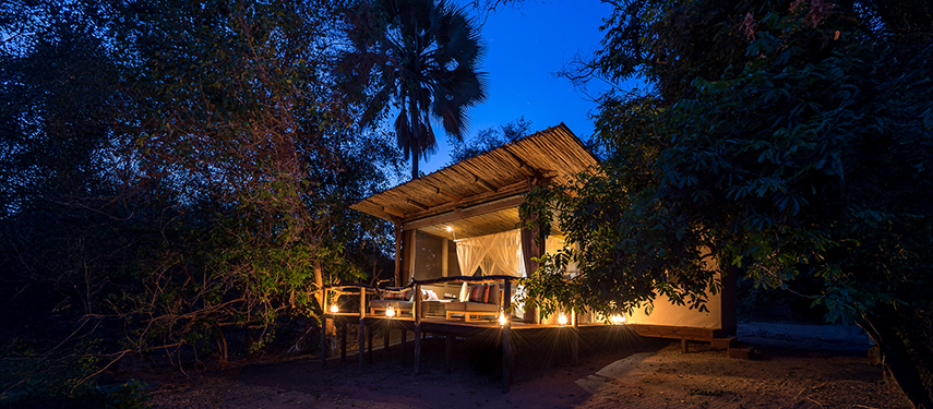 The exterior of a private safari suite at night Little Ruckomechi Camp, Zimbabwe
