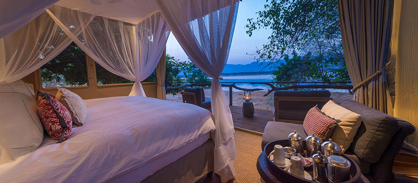 The sumptuous interior of a private safari suite at Little Ruckomechi Camp, Zimbabwe