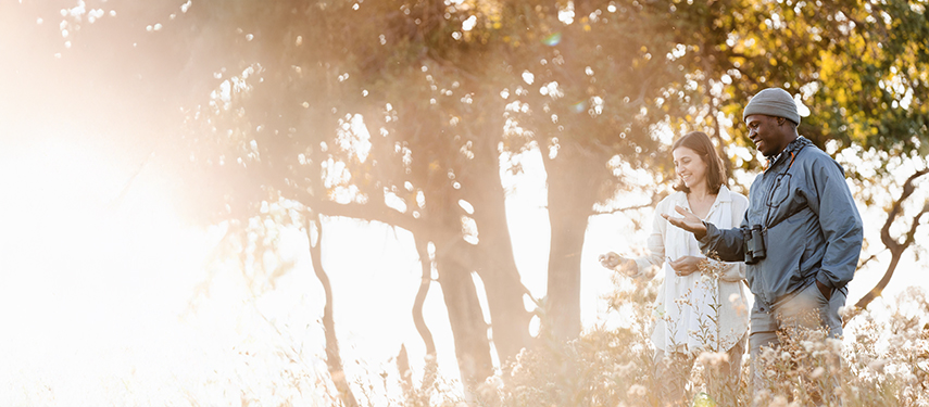 Female guest and safari guide in Botswana's Okavango Delta