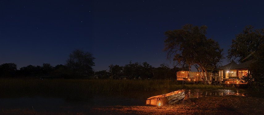 Little Vumbura luxury safari lodge at night in the Okavango Delta, Botswana