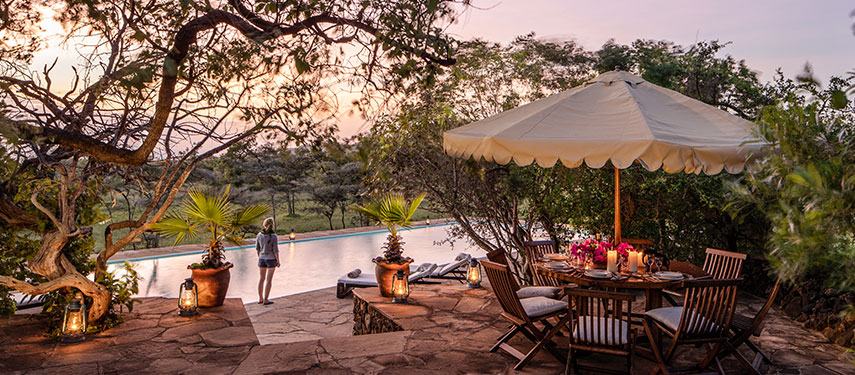 Sundowners at the foot of the Chyulu Hills at Camp Ya Kanzi