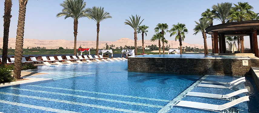 Relax in the pool overlooking the Nile's east bank at the Hilton Luxor Resort & Spa