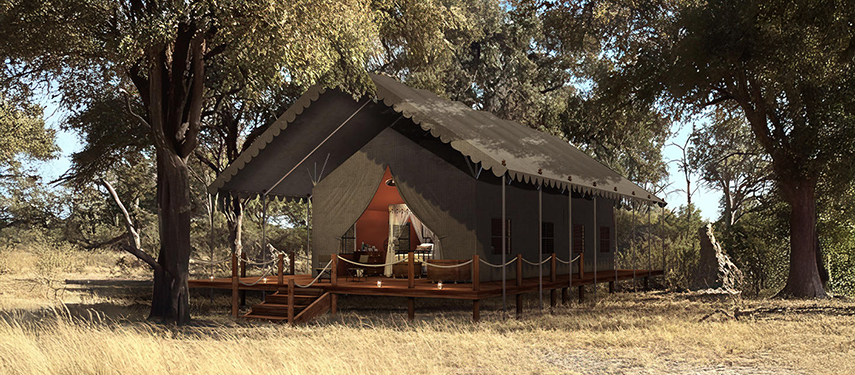 Exterior of a luxurious guest tent at Mbamba Camp shaded by tall trees.