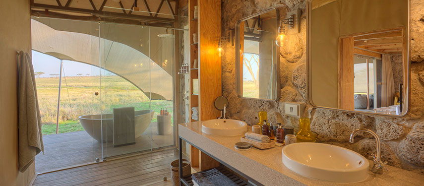 Indulgent en suite private bathroom at Namiri Plains camp in the Serengeti