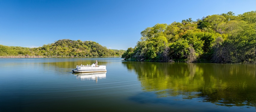 Tourists fishing on Malilangwe Dam, Zimbabwe