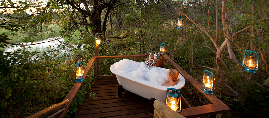 Enjoy a private bath on your deck at Pom Pom Camp in Botswana