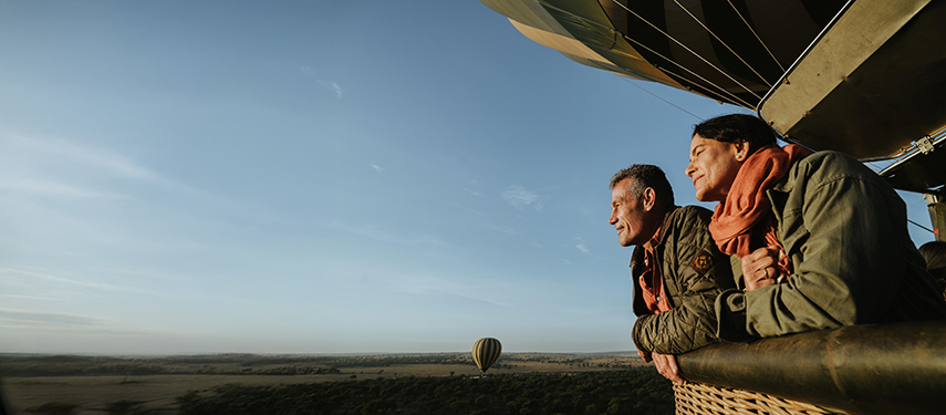 Couple enjoying a hot-air balloon flight over the Serengeti