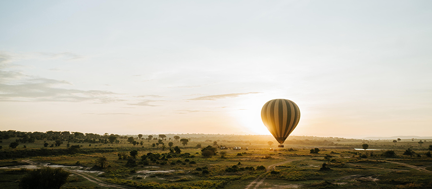 Hot-air balloon drifting over the Serengeti