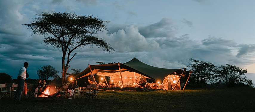 Usawa Serengeti mobile tented safari camp at night