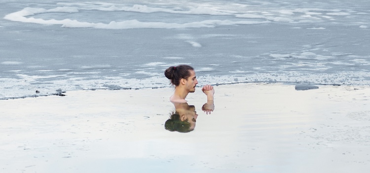 Man Ice Bathing In The Cold Water Of A Lake. Wim Hof Method, Cold Therapy, Breathing Techniques, Yoga And Meditation