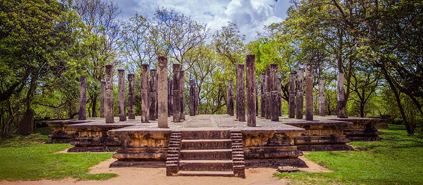 Ancient stone pillars of a ruined temple at the historic site of Anuradhapura, Sri Lanka.