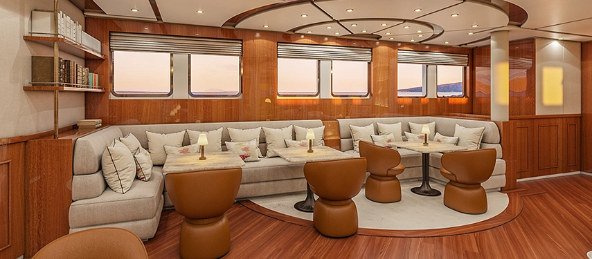 Refined saloon with warm wood finishes, comfortable seating and panoramic windows.