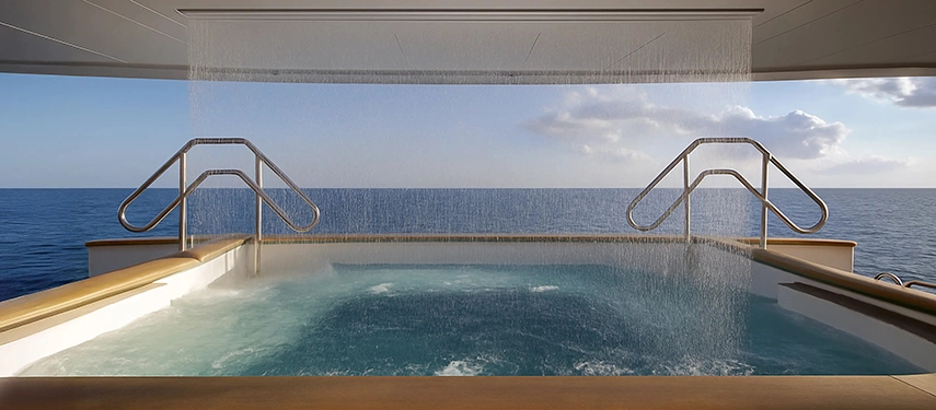 Jacuzzi pool with cascading water overlooking the open sea.