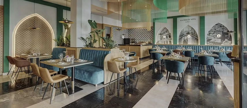 Stylish restaurant interior with bold colours, patterned walls, and contemporary furniture arranged in a relaxed setting.