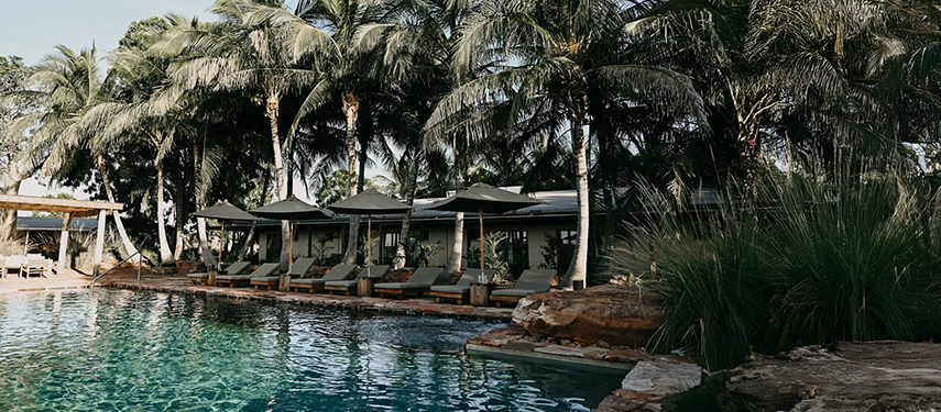 Palm-fringed swimming pool at the Bullo River Station homestead