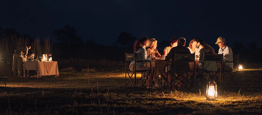 Candlelit bush dinner under the night sky at Cha Cha Metsi.