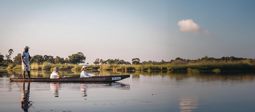 Mokoro excursion gliding peacefully through the Okavango Delta channels.
