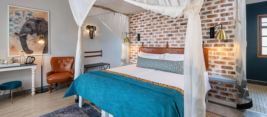 Bright and stylish en suite room at Etosha Safari Lodge