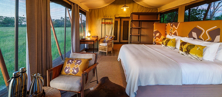 A spacious tented suite at Karangoma Camp combines elegant safari styling with expansive views over the Okavango Delta floodplains.