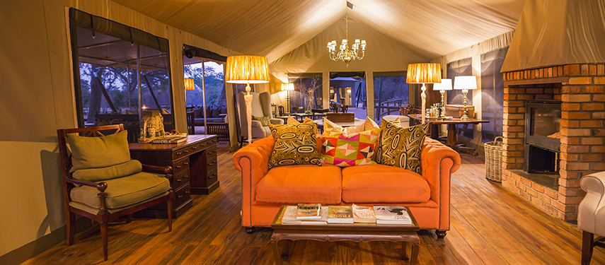 Cosy camp lounge with eclectic furnishings, soft lighting and an inviting atmosphere at Verney’s Camp.