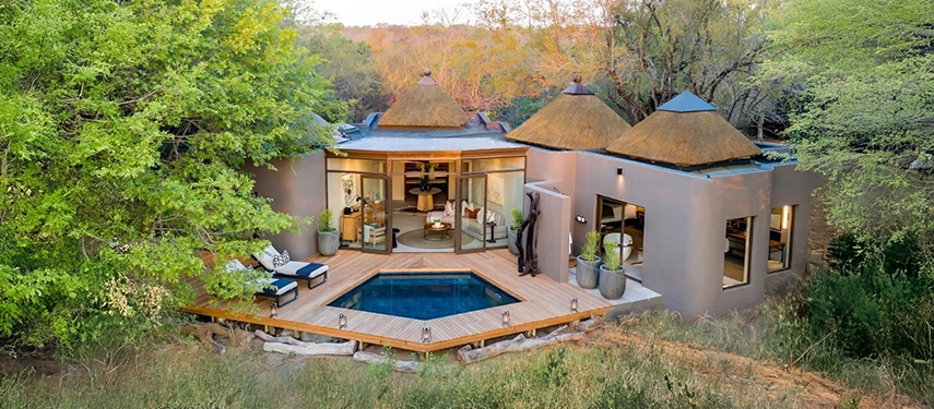 Aerial view of the luxurious Mandleve Villa at Sabi Sabi Bush Lodge with private plunge pool and thatched roof design.
