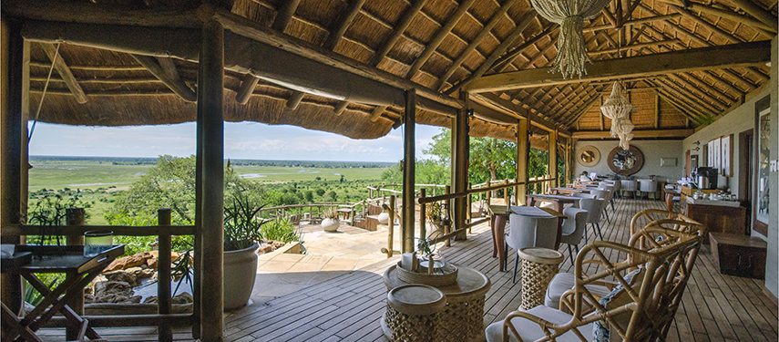 Spacious thatched veranda of Ngoma Safari Lodge offering panoramic views across the Chobe River floodplains.