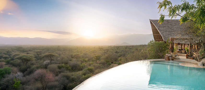 Infinity pool at sunrise with sweeping views over a canopy of acacia trees at Reteti House.
