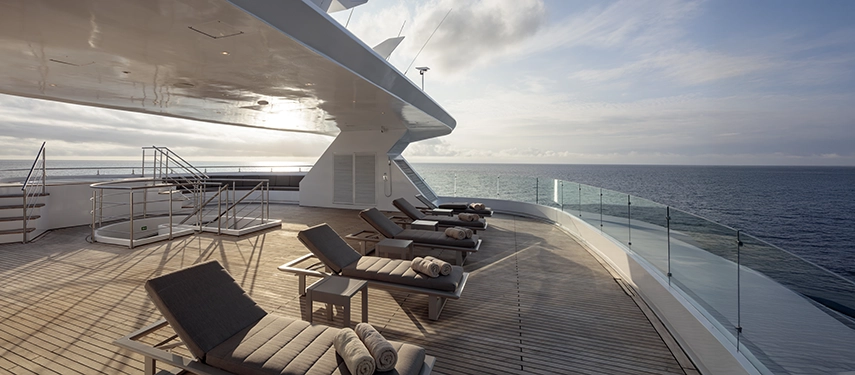 Spacious sun deck with loungers and panoramic ocean views aboard the Hermes Galápagos Mega Catamaran.