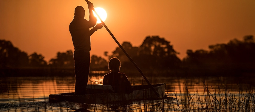 Mokoro canoe safari at sunset near Thamalakane River Lodge