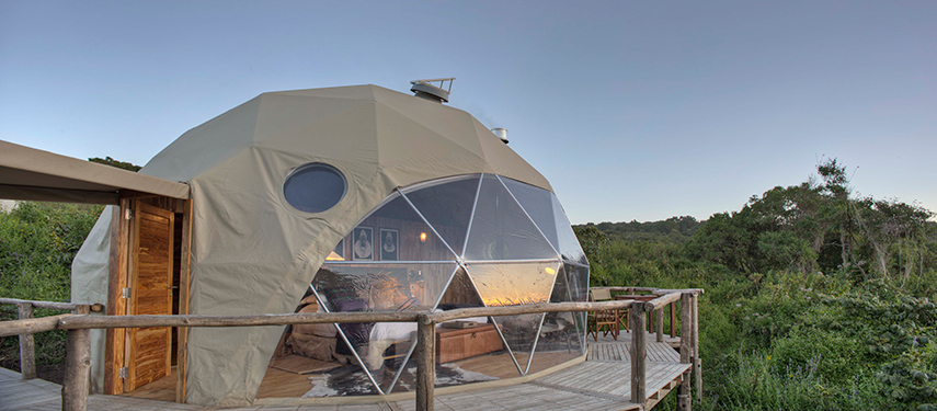 Exterior of a Highlands dome suite with private deck overlooking the wilderness