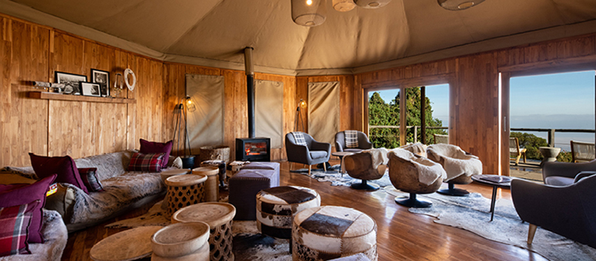 Spacious and rustic-chic lounge area at The Highlands with forest views