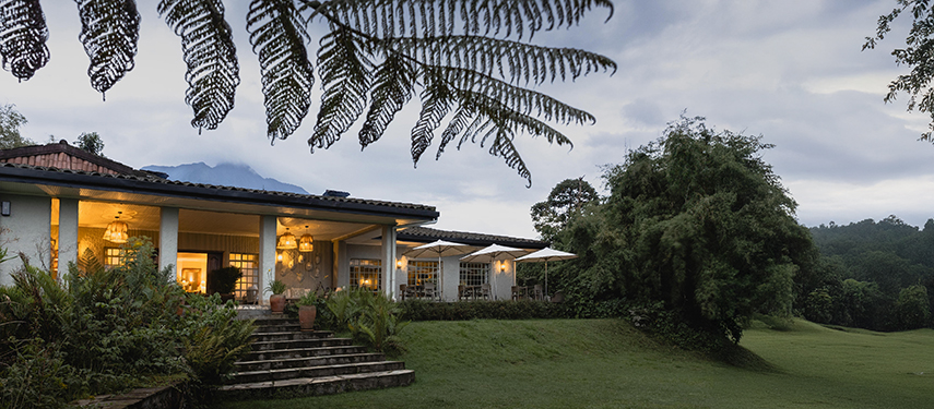 Elegant guest rooms at Sabyinyo Lodge overlook the surrounding mountains of the Volcanoes National Park